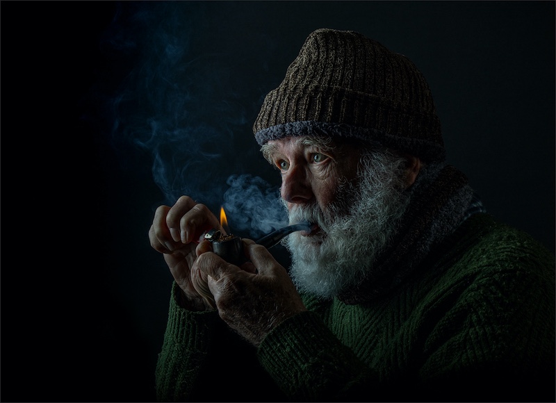 PSSA Silver Medal - Human Portraits - Lighting the Pipe 1828 - Natasha  Bird - Southern Suburbs Camera Club